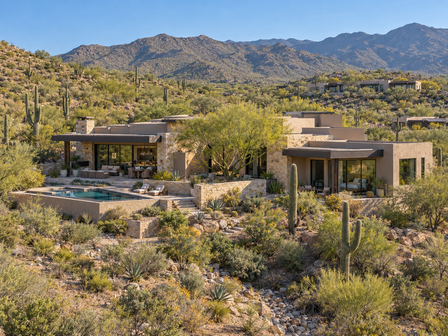 Modern desert home framed by mountains and Sonoran landscape